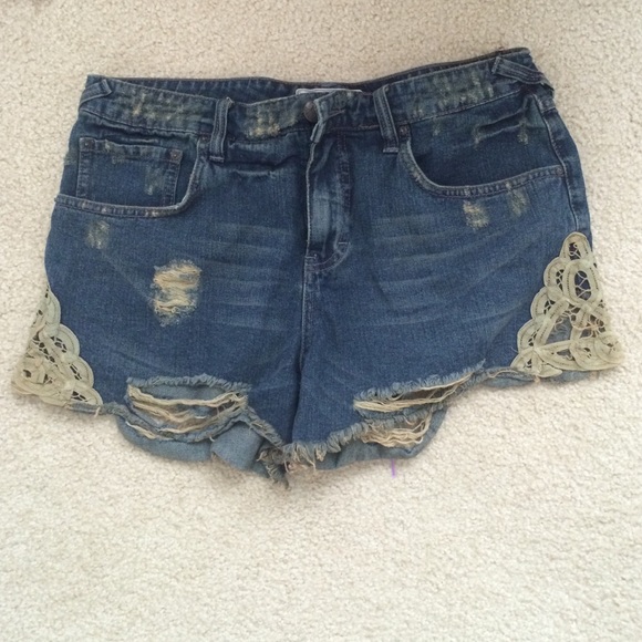 Free People denim shorts with lace and rips