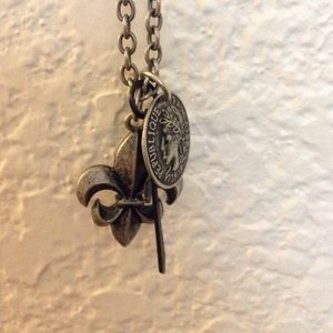 fleur d lise,cross, and coin necklace