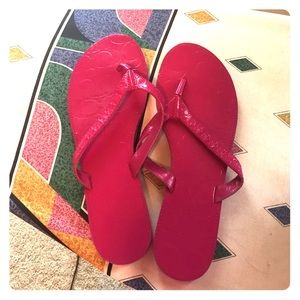 Coach flip flops in fuschia