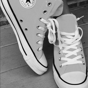 Converse Chuck Taylor All Stars in neon orange.