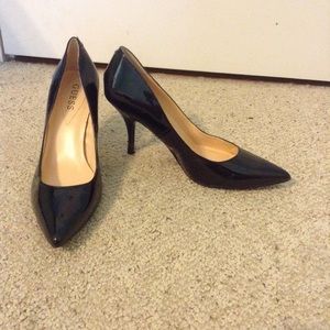 Black Guess pointed toe pumps. Size nine.