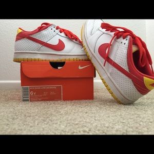 I'm selling a pair of orange yellow white nikes