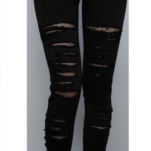 Tripp NYC black ripped and fishnet jeans. Size 1