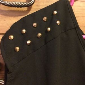 Black open backed tee shirt with gold spikes
