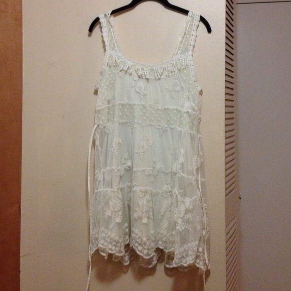 Embroidered ivory tunic with self-tie back