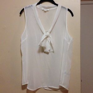 Sheer white top with self-tie neck