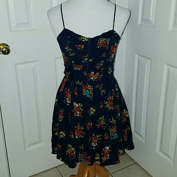Navy floral a-line dress with ruched zipped top