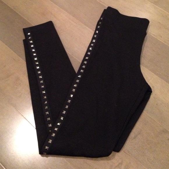 Cute black tights with side gunmetal stud detail.