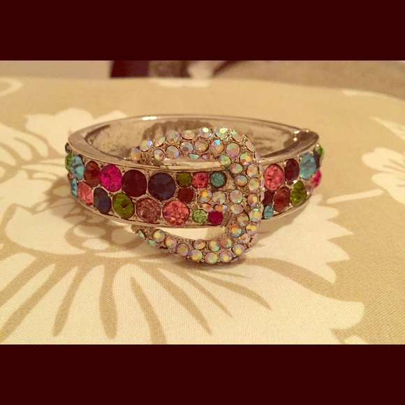 Buckle-inspired fashion bracelet with gemstones.
