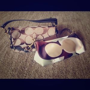 Two Coach wristlets