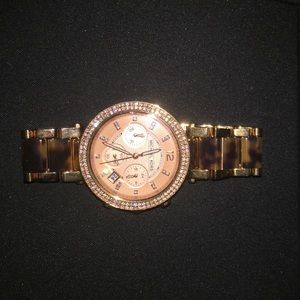 Micheal Kors rose gold - tortoise shell watch.