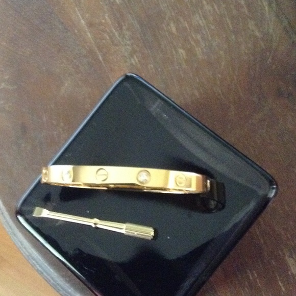 18Kt Screw/Diamond Bracelet says Cartier.