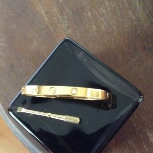 18Kt Screw/Diamond Bracelet says Cartier.