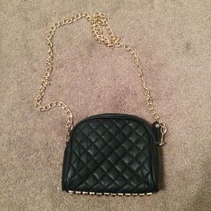 Black quilted cross body bag with studded bottom