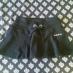 Short black bebe skirt