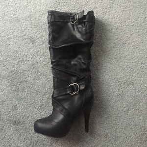 Black boots just under the knee