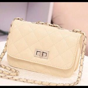 A beige Body Chain Shoulder Bag