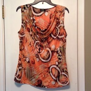 Soft  orange/green/brown  shirt with drape neck.