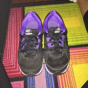 Purple and black nikes