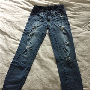 Medium Wash destroyed skinny ankle jeans