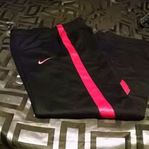 Nike Dri Fit pants. Red and black