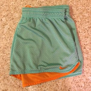 Nike women seafoam green/orange shorts