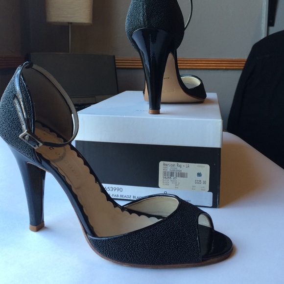 Marc Jacobs black beaded peep toe heels.