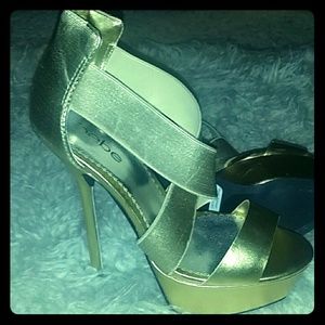 Gold Bebe platform stilettos.