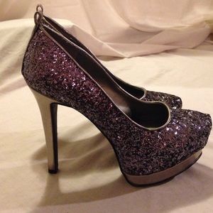 New size 5.5 purple sequined spike heels.