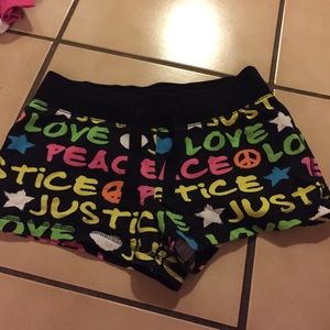 Neon peace love justice shorts