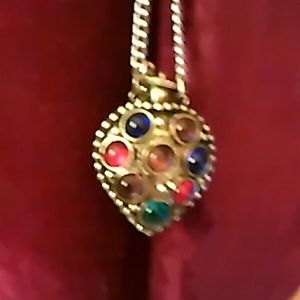 Vintage perfume pendant chain is attached