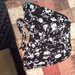 A black and white, floral blouse