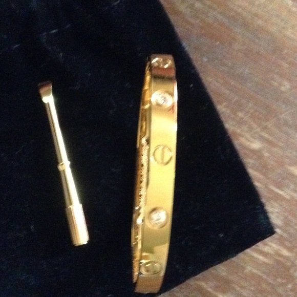 18KT SCREW/ DIAMONDS SAYS CARTIER