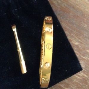 18KT SCREW/ DIAMONDS SAYS CARTIER