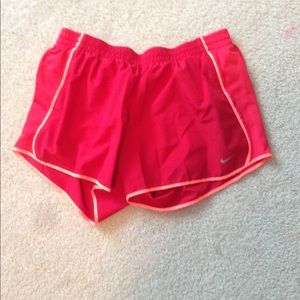 Red Nike shorts