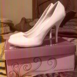 White patent leather pumps