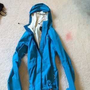 Turquoise blue rain jacket from the North Face