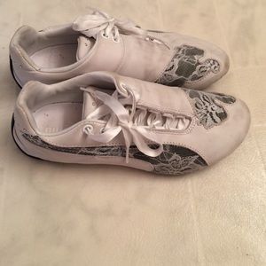 Lace Pumas with rhinestone detailing.