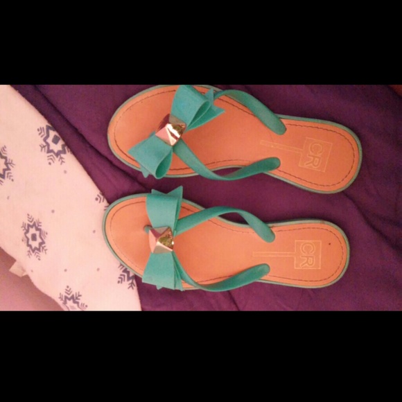 Turquoise stud bow flip flops