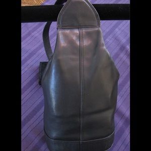 Black leather sling bag.