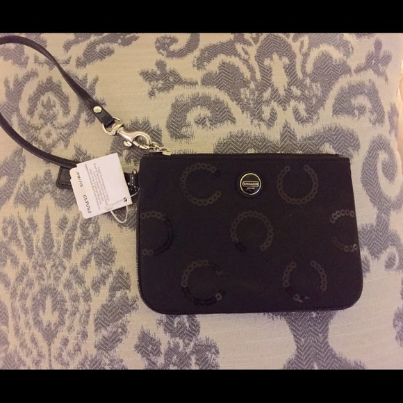 Coach black wristlet.
