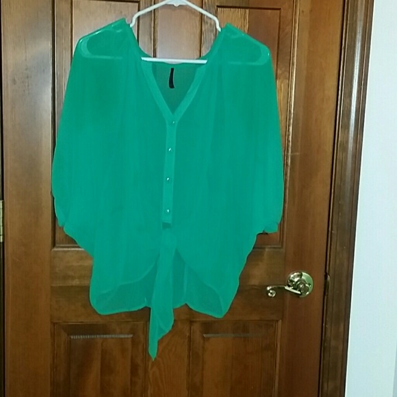 Nice sheer teal color top.