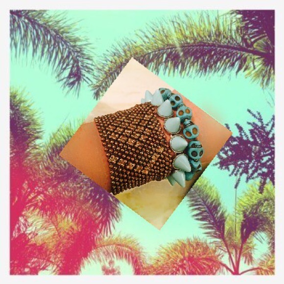 3 bracelet bundle; gold cuff, teal skulls/spikes