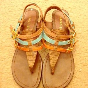 Strappy brown sandals with a small wedge