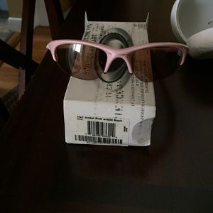 Pink Oakley sunglasses.