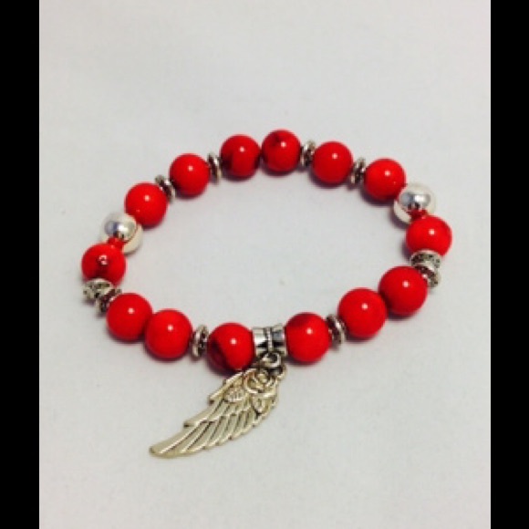Coral with antique silver wing