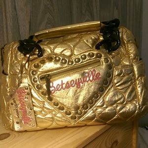 Betseyville small gold duffle purse