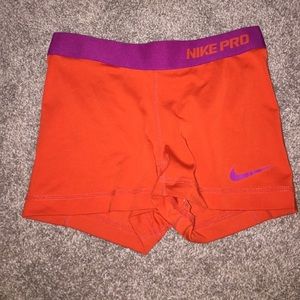 Orange and Purple Nike Pros