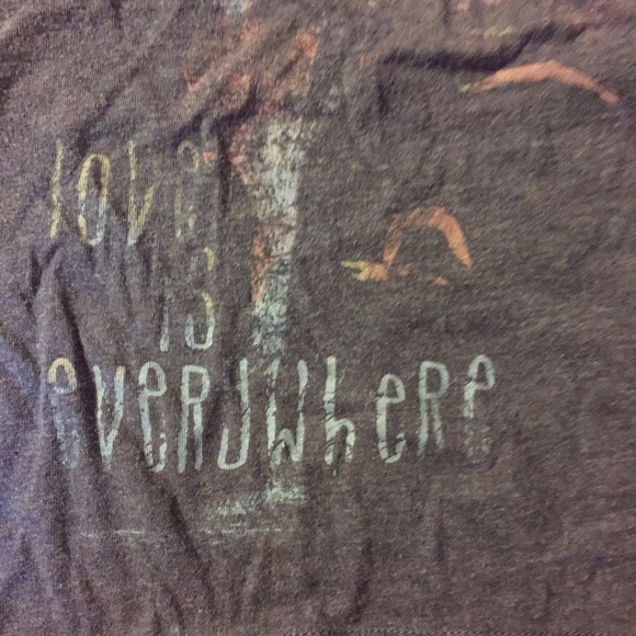 I'm selling a blue shirt with a design.