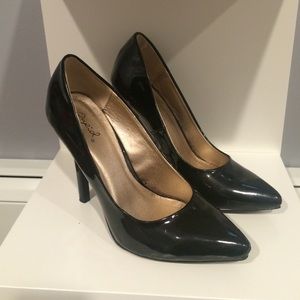 Black patent leather pumps.